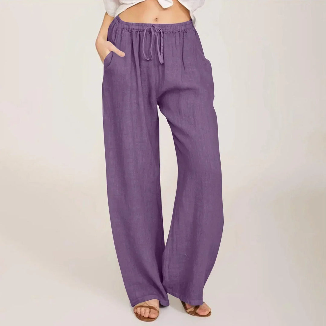 Relaxed fit women's high waisted wide leg pants, perfect casual wear with a stylish drawstring.
