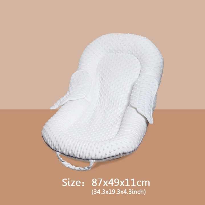 Washable baby nest for infants (0-12 months), ergonomic design with breathable mesh & back support.