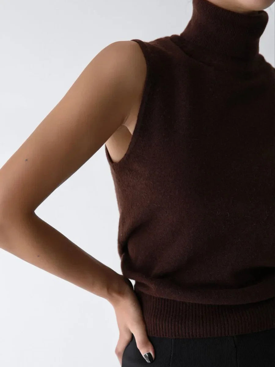 Modern women's sleeveless turtleneck, ideal for creating sophisticated layering looks.