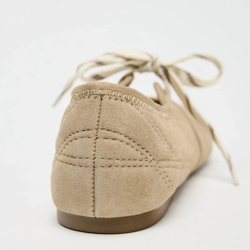 Women's comfortable everyday ballet flats, featuring a lace-up design for adjustable comfort.