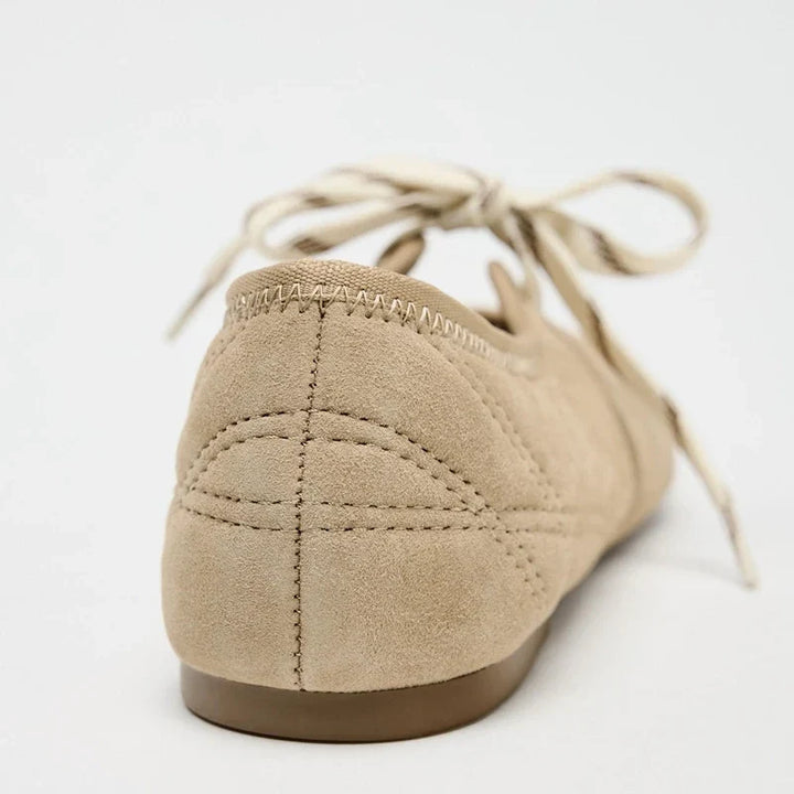 Women's comfortable everyday ballet flats, featuring a lace-up design for adjustable comfort.