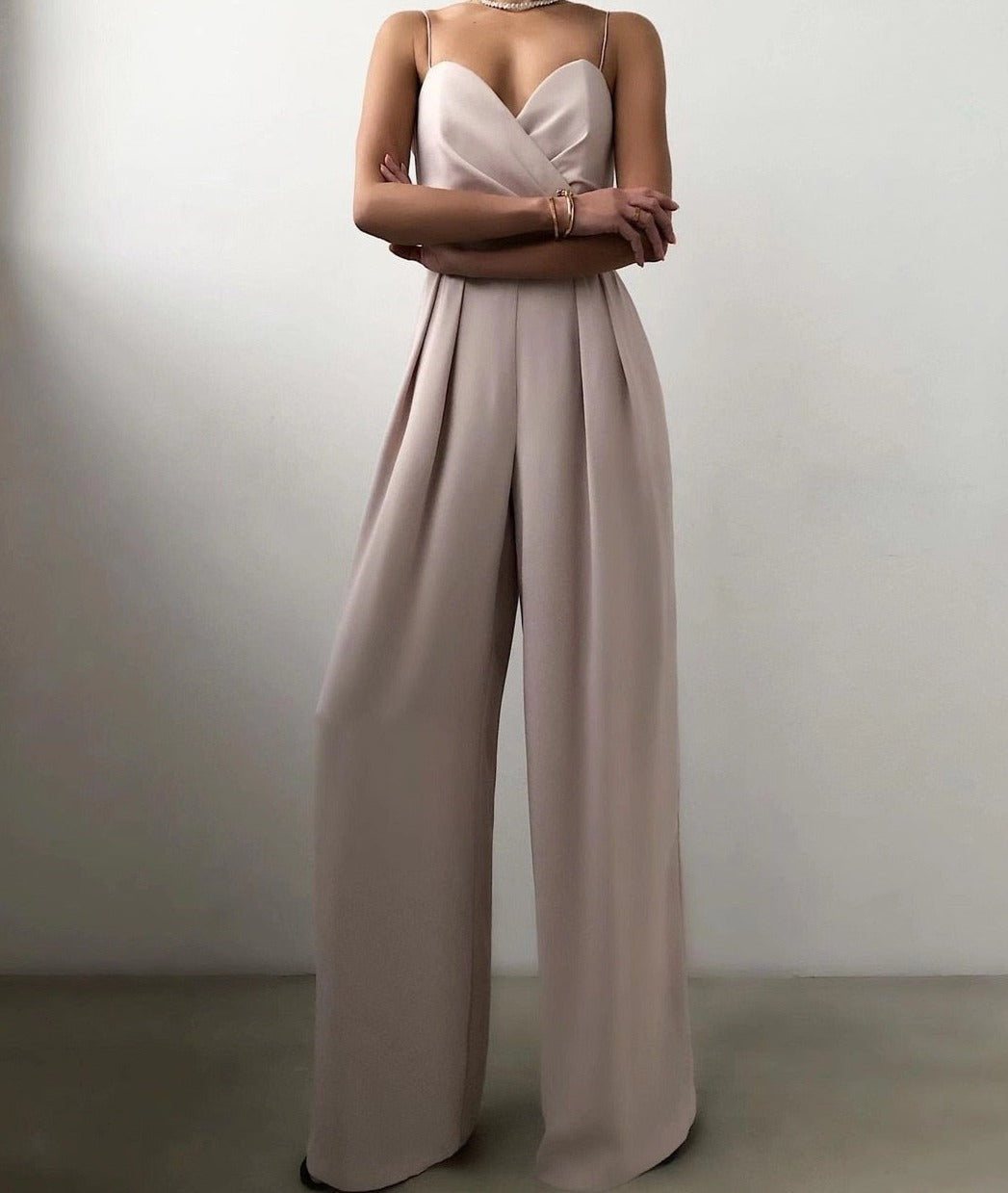 Chic sleeveless wide-leg jumpsuit for women, a sophisticated modern evening wear or party outfit.
