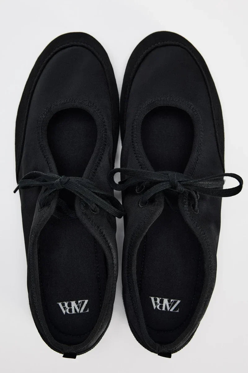 Elegant women's lace-up ballet flats, perfect for versatile styling and all-day comfort.