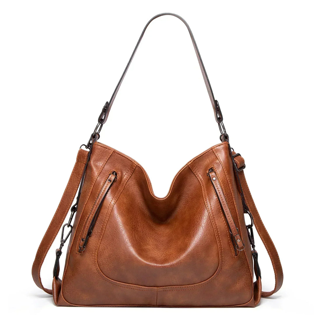 Women's vintage brown leather shoulder bag, perfect for everyday style. Durable and spacious fashion accessory.