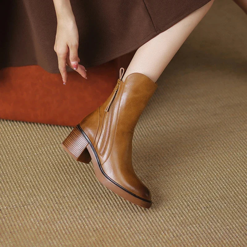 Fashionable women's elegant zip ankle boots for fall/winter, offering both style and comfort for any occasion.