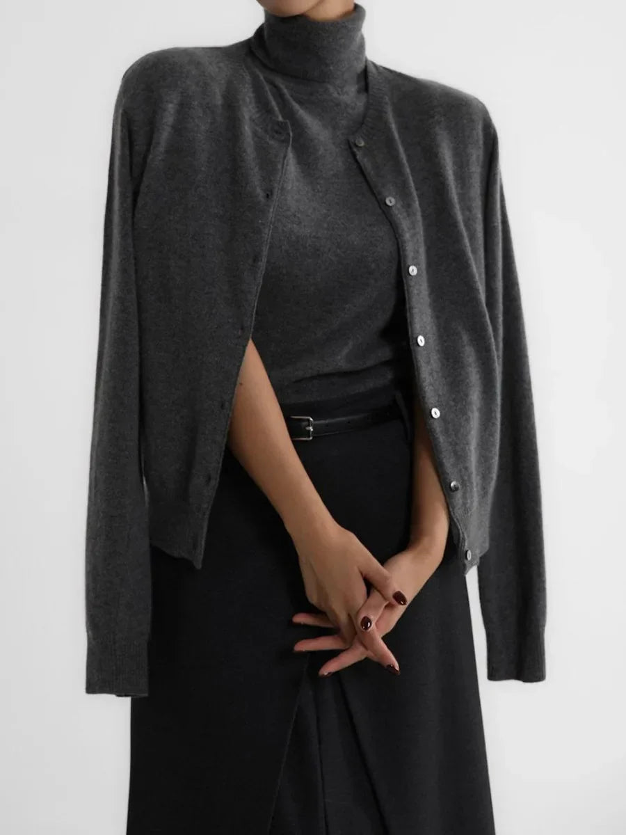 Women's sophisticated turtleneck sleeveless blouse, a versatile piece for elegant styling.