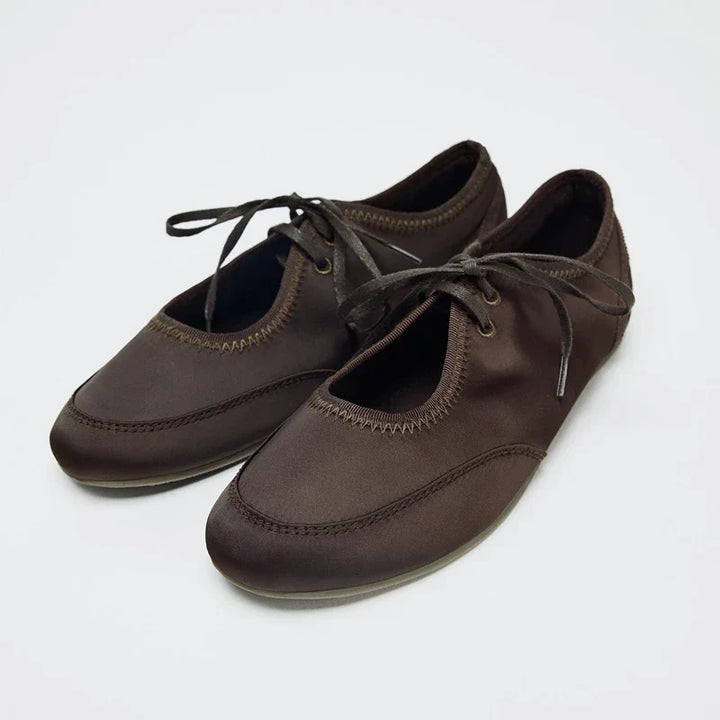 Stylish women's lace-up ballet flats, offering a perfect blend of comfort, fashion, and versatility.
