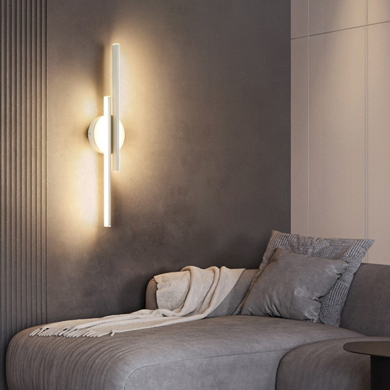 Modern LED wall sconce with cool white ambient light. Dimmable, perfect for contemporary spaces.