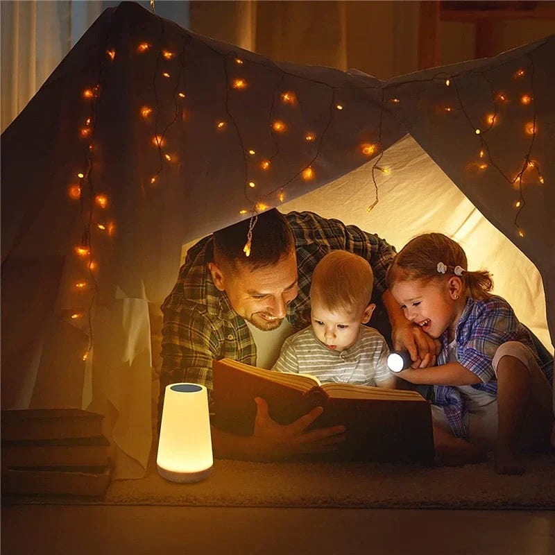 Hand touching a multicolor LED night light, demonstrating intuitive touch control & dimmable ambient glow.