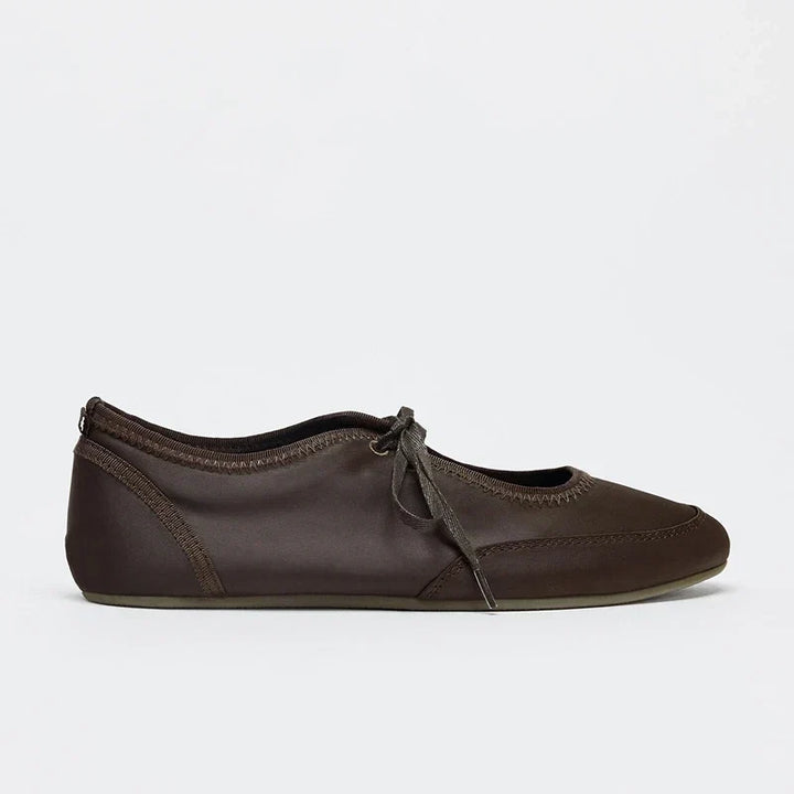 Women's fashion ballet flats with secure lace-up closure, ideal for comfortable all-day walking.