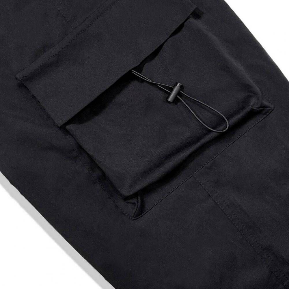 Man wearing comfortable men's relaxed fit cargo joggers for a laid-back streetwear vibe.