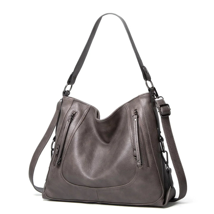 Genuine leather shoulder bag for women, featuring a vintage look. Versatile and durable for daily fashion.