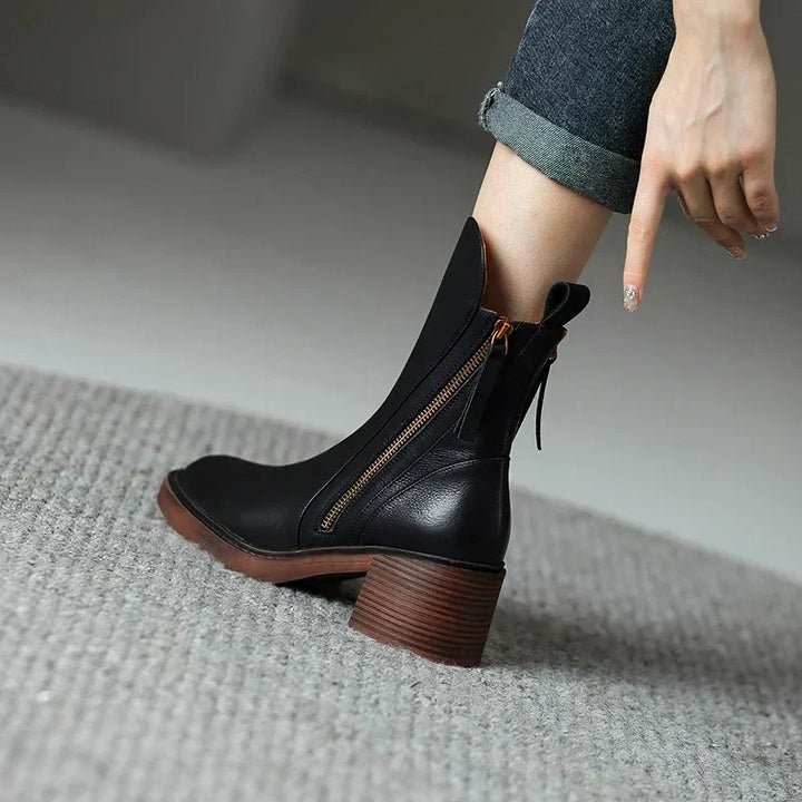 Comfortable women's ankle boots with elegant design and practical zip closure, ideal for daily fashion.