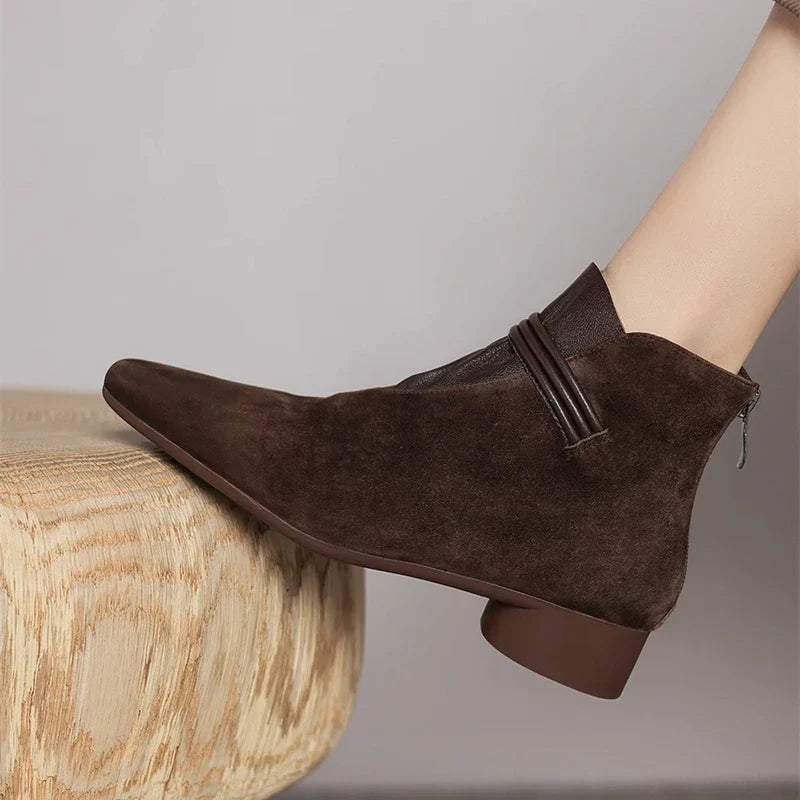 Comfortable brown women's low heel booties, everyday ankle boots with easy side zip closure.