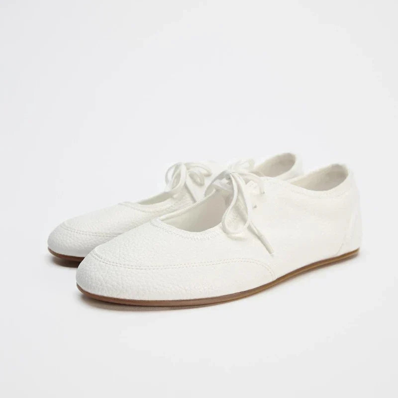 Women's casual lace-up ballet flats in a soft grey, designed for everyday wear and walking.