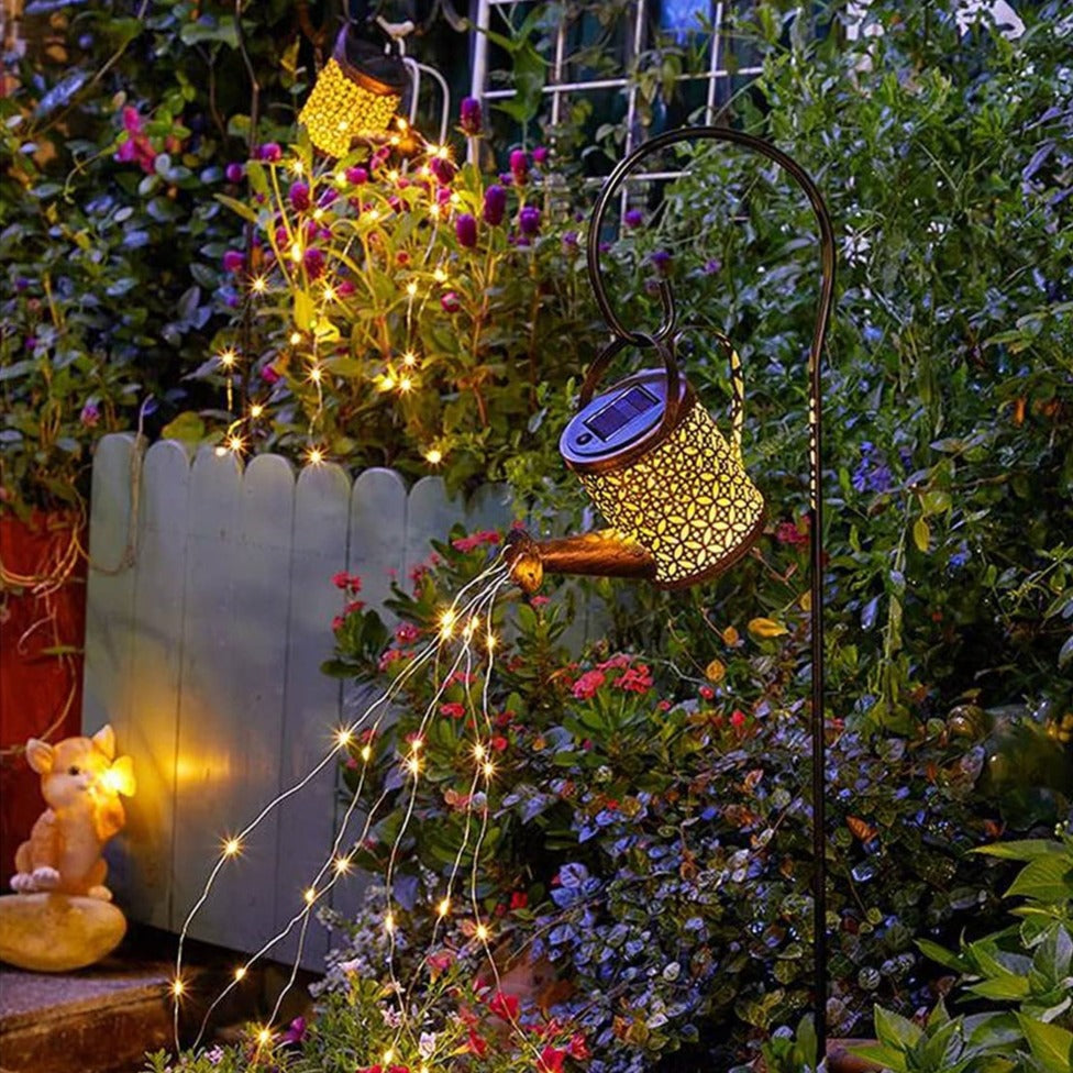 Decorative solar watering can light for garden. Features LED pouring effect, perfect for outdoor landscape and yard accent lighting.