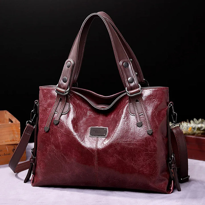 Close-up of genuine leather on a women's shoulder bag, showcasing its durable and stylish texture. High-quality material.