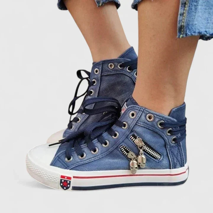 Full view of women's denim high-top fashion sneakers with prominent zip and stud details for a cool, casual vibe.