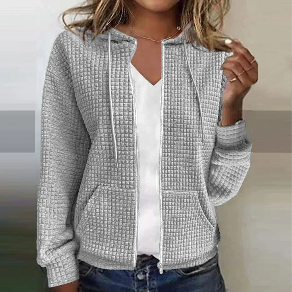 Chic women's checked water-repellent jacket for stylish warmth, ideal casual outerwear in cool weather.