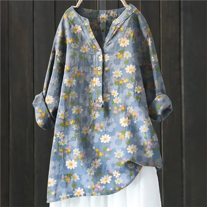 Woman wearing a stylish floral long-sleeve blouse, ideal for spring casual elegance.