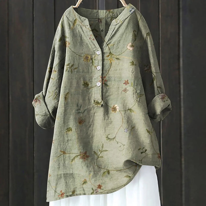 Versatile women's floral top, elegant long-sleeve design for chic spring/summer outfits.