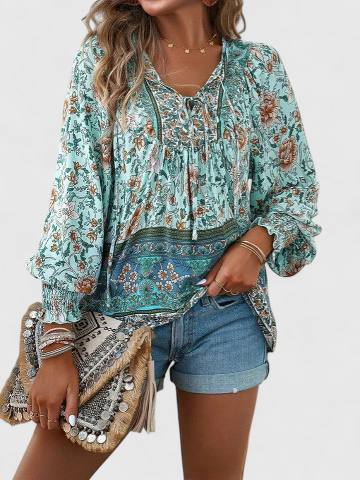 Versatile women's long sleeve print blouse, V-neck lace-up detail. Styled for bohemian or casual looks.