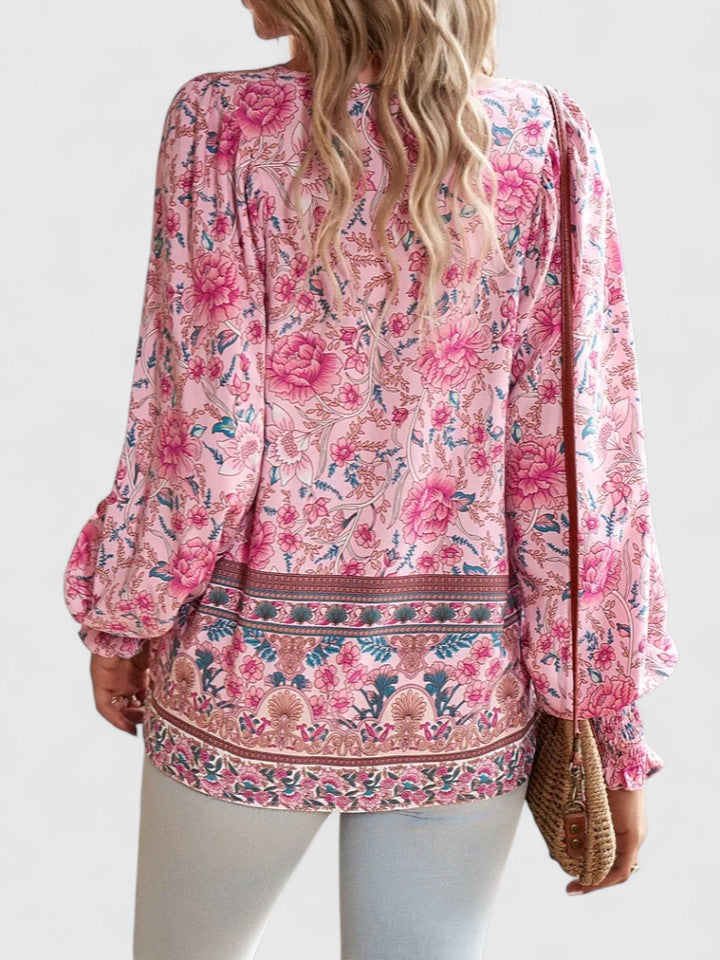 Front view: Women's boho V-neck lace-up blouse, showcasing intricate print & flowy silhouette. Summer fashion.