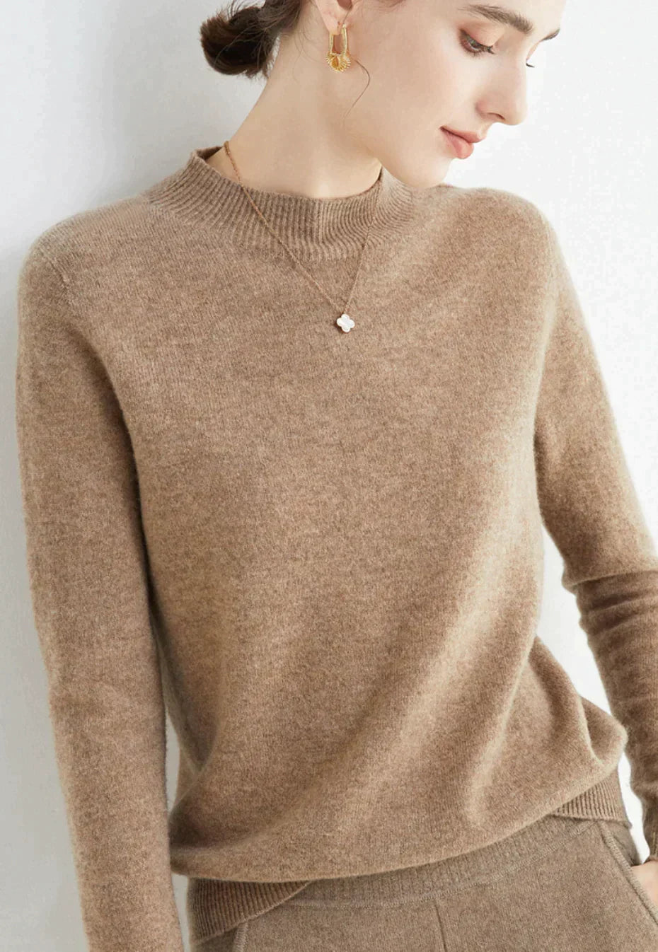 Chic Cindie soft knit pullover. Elegant long-sleeve women's sweater for cozy winter fashion.