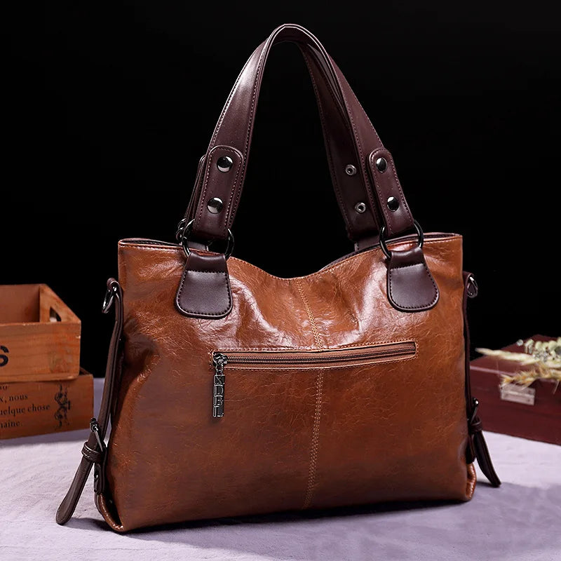 Organized interior of a women's genuine leather shoulder bag with multiple compartments for essentials. Practical everyday bag.