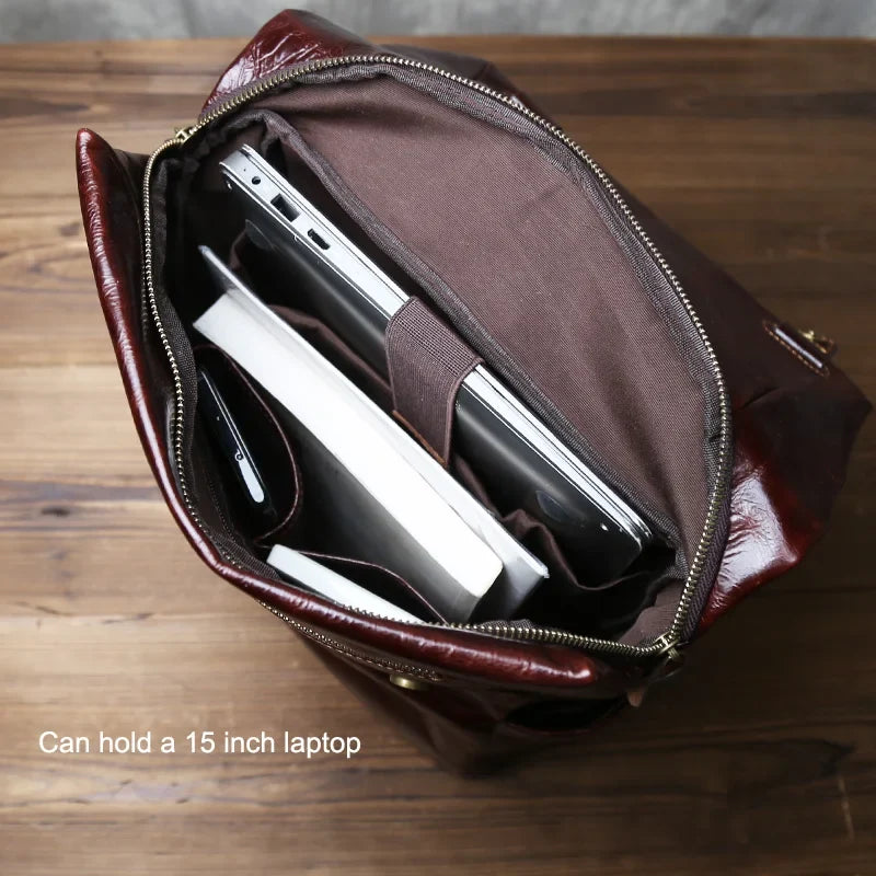 Stylish men's large capacity laptop backpack made from durable leather, perfect for business and daily commute.