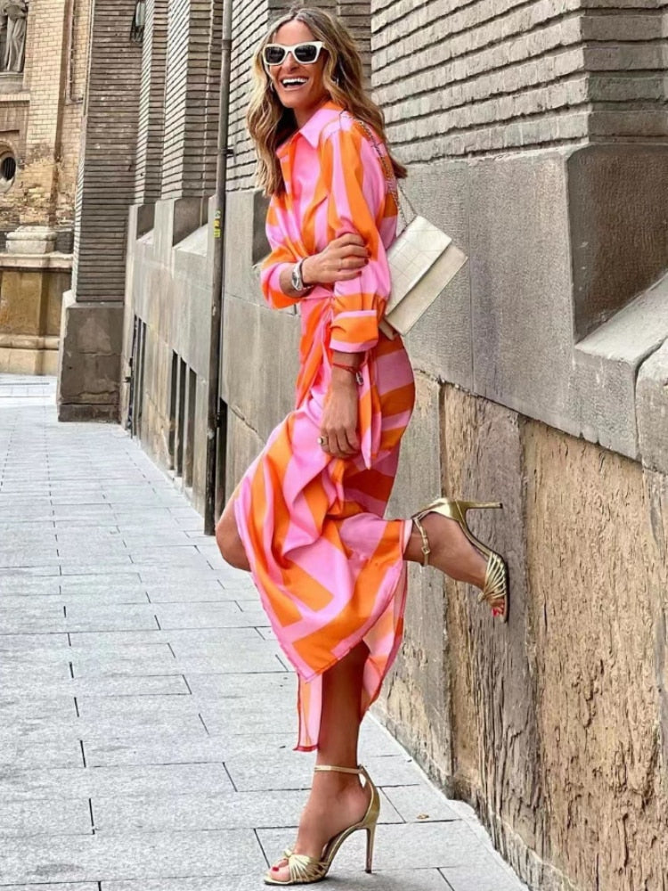 Flowy women's summer wrap midi dress, offering versatile and feminine style for warm weather fashion.