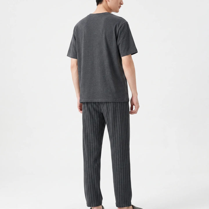 Relaxed fit men's two-piece short sleeve sleepwear set with elastic waist.