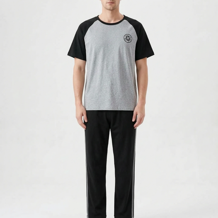 Two-piece men's short sleeve pajama suit, relaxed fit for summer comfort.