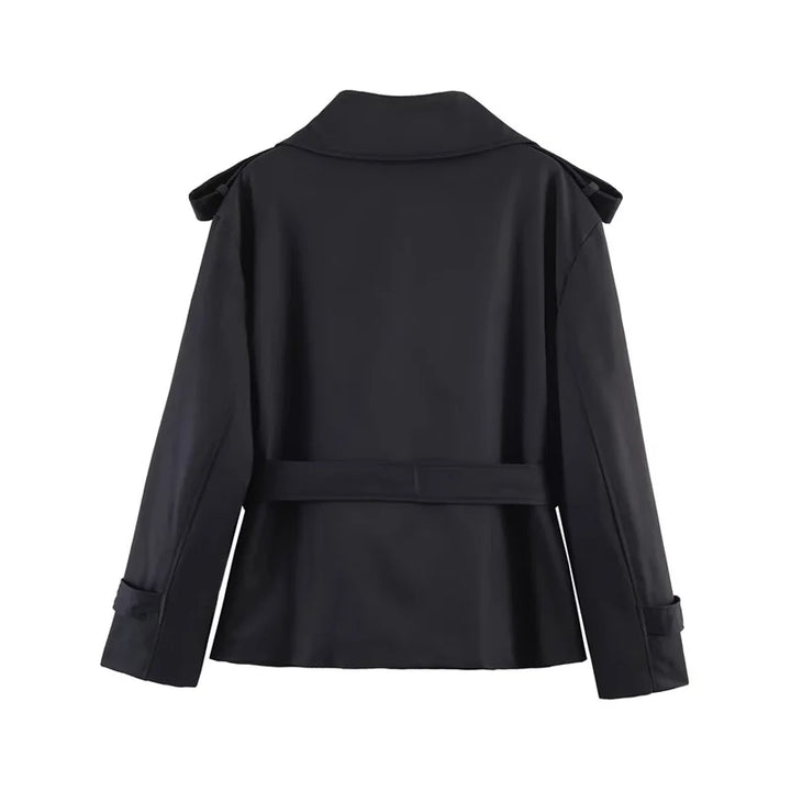 Modern short trench coat with adjustable belt, designed for women.