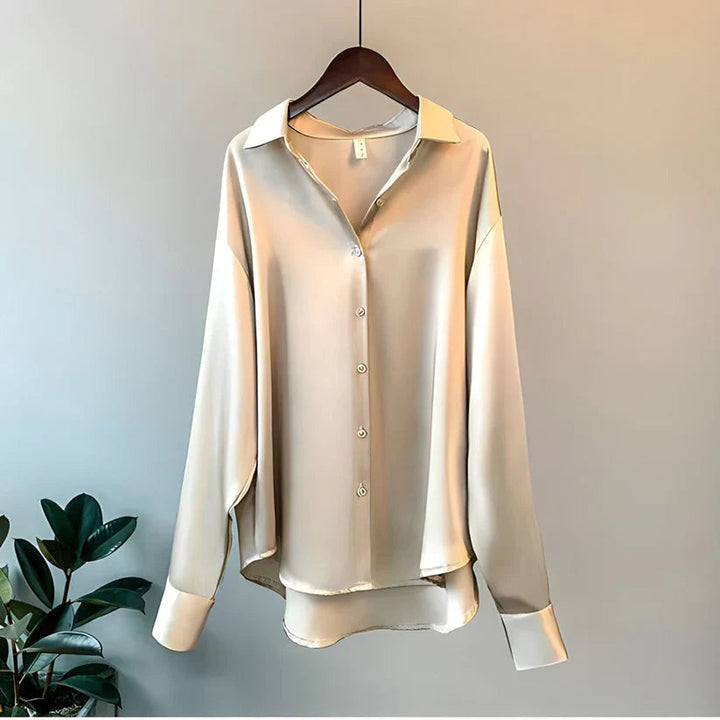 Sophisticated women's collared long-sleeve blouse, a stylish flowy top for elegant office wear.