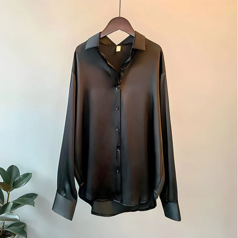 Elegant women's flowy blouse for formal or casual wear, a comfortable long-sleeve top.