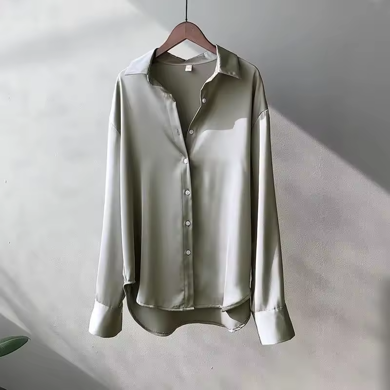 Sophisticated women's flowy long-sleeve blouse, an elegant top for versatile fashion and office wear.