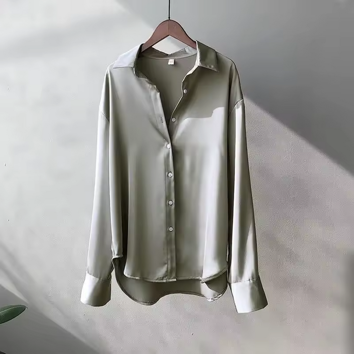 Sophisticated women's flowy long-sleeve blouse, an elegant top for versatile fashion and office wear.