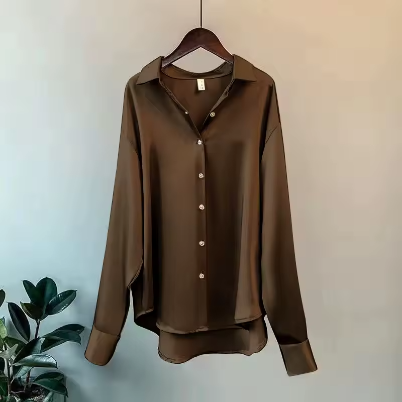Stylish women's flowy long-sleeve blouse, a versatile elegant top perfect for casual or formal fashion.