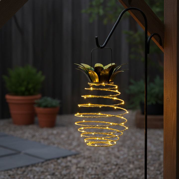 Decorative solar pineapple lantern for outdoor garden and patio lighting. Eco-friendly and no wires.