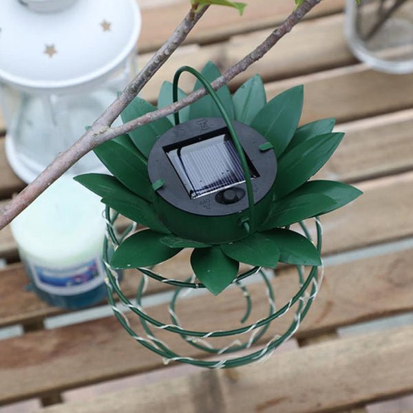 Rustic solar pineapple lantern for enchanting outdoor garden decor. Wireless, energy-efficient patio lighting.