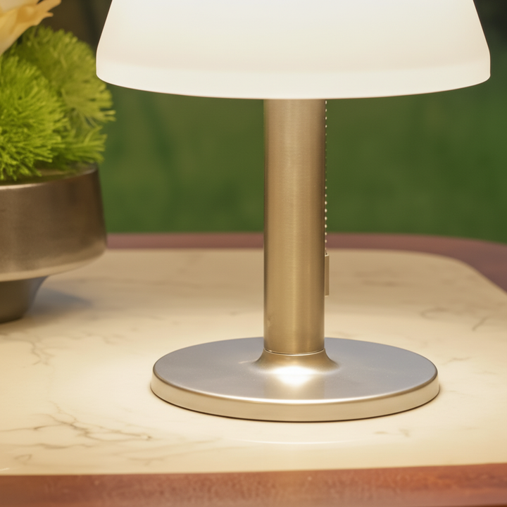 Decorative solar-powered table lamp for outdoor spaces. Adds warm ambient glow to garden, balcony & patio decor.