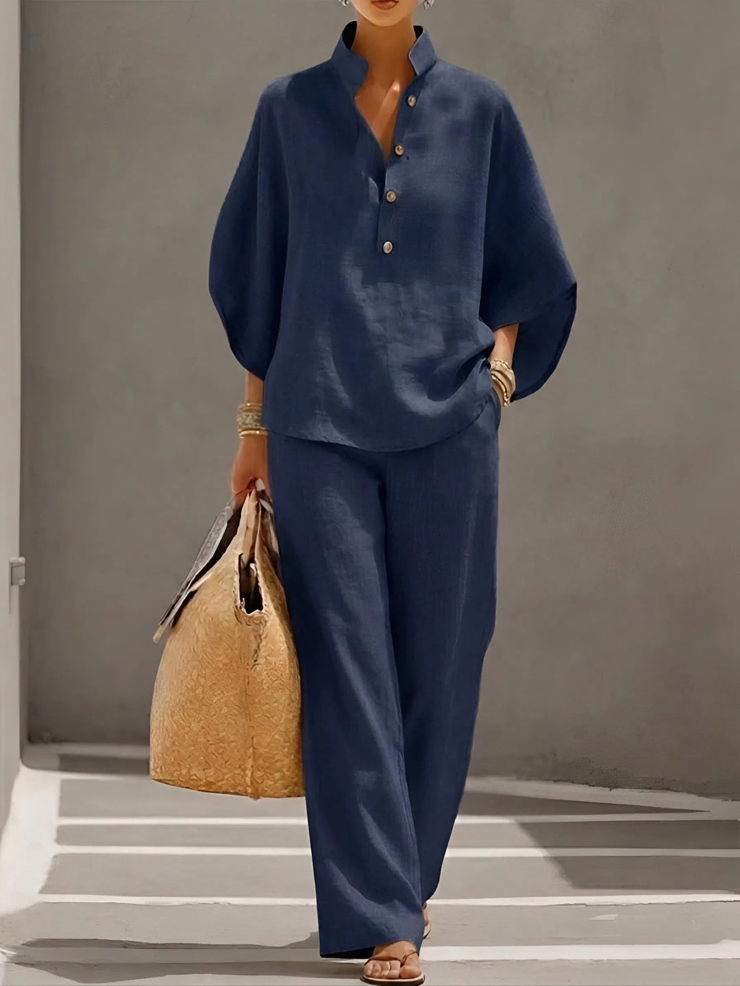 Comfortable women's relaxed fit matching set: breathable button-up top & wide-leg pants for summer.
