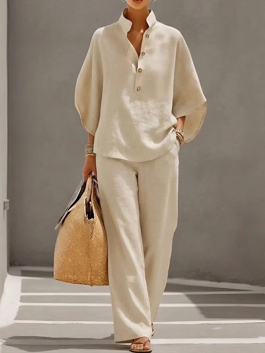 Soft & elegant women's breathable button-up two-piece set, featuring a relaxed fit top & wide-leg pants for comfort.