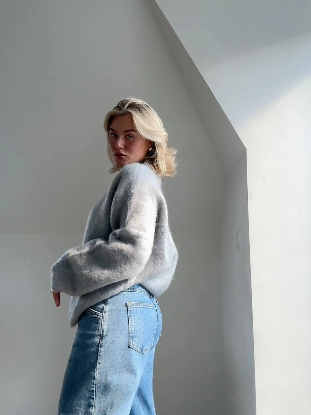 Warm & elegant women's sweater, cozy knit top for fall/winter fashion, perfect for layering.