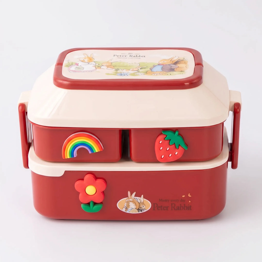 Healthy meals made easy with this multi-tier stackable kids lunch box; includes utensils.