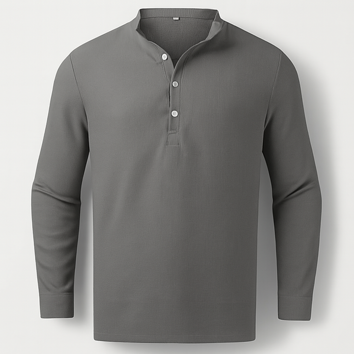 Man wearing a comfortable long sleeve Henley top, great for relaxed everyday activities and casual outings.