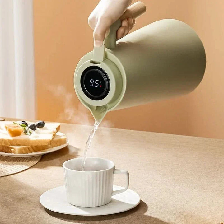Durable 1-liter insulated thermos carafe keeps coffee & tea hot for hours, a must-have home essential.