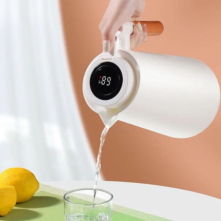 Portable 1L insulated thermos carafe for hot beverages, featuring a clear smart temperature display.