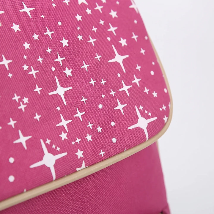 Close-up of blue canvas school backpack with white star pattern, part of a practical 3-piece student set.